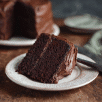 Slice of keto chocolate cake with rich chocolate frosting
