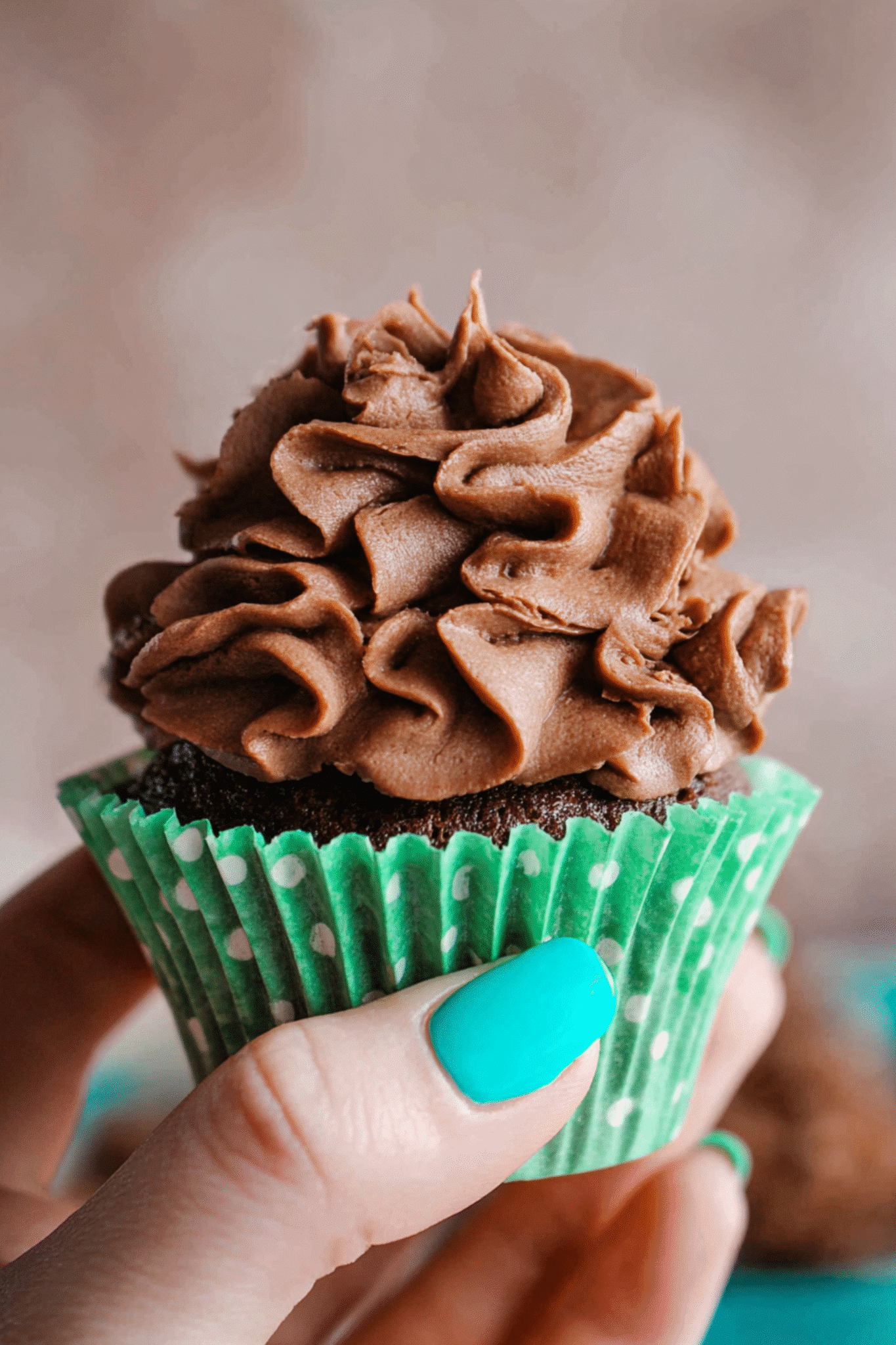 Whipped Ganache on Chocolate Cupcake Whipped ganache recipe piped onto chocolate cupcake