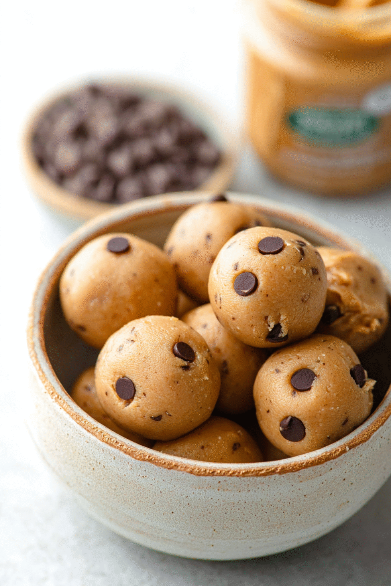 Keto Peanut Butter Protein Balls in Ceramic Bowl Keto Peanut Butter Protein Balls in ceramic bowl with chocolate chips