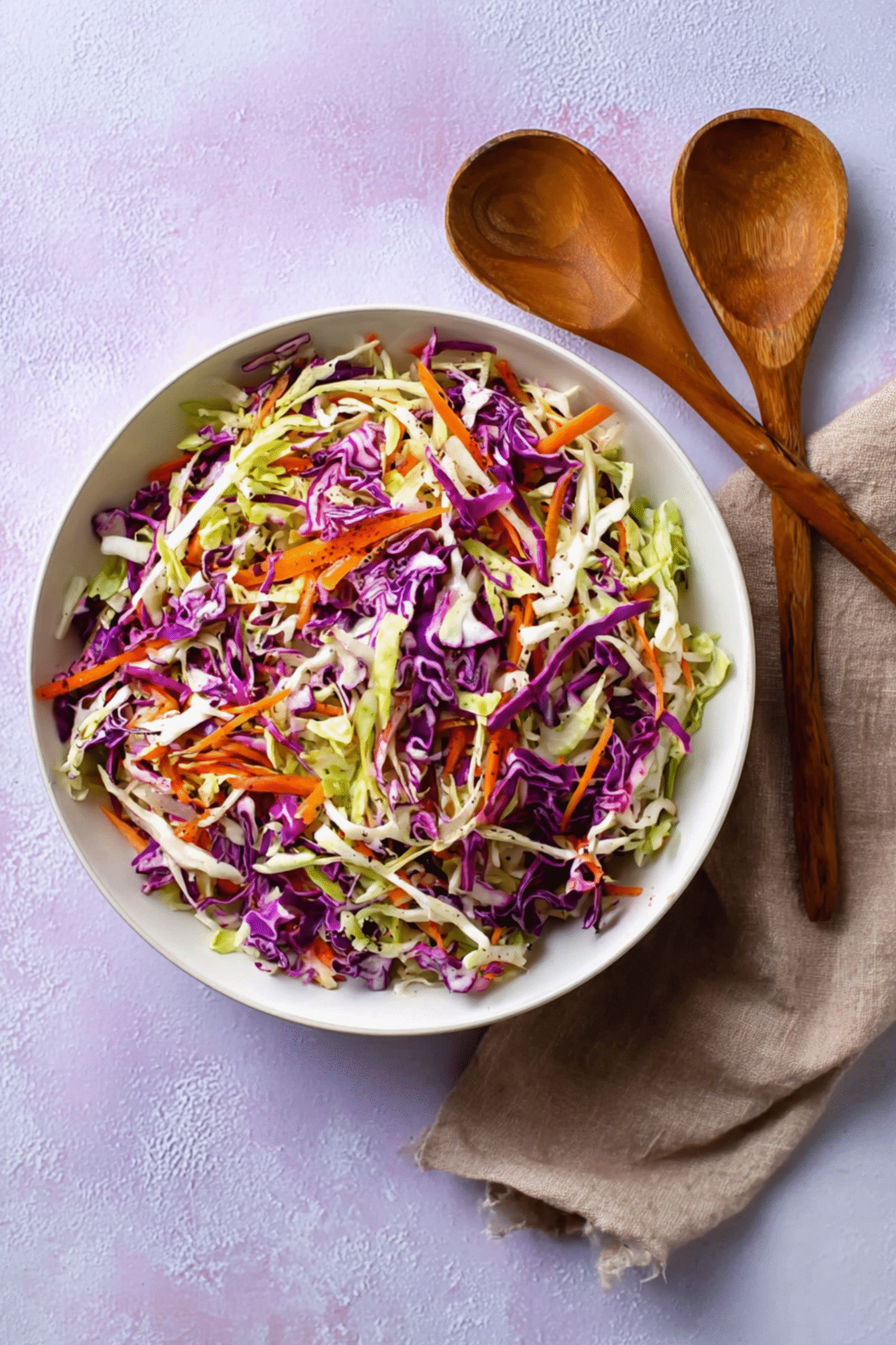 Serving Cabbage and Carrot Salad Serving cabbage and carrot salad in white bowl